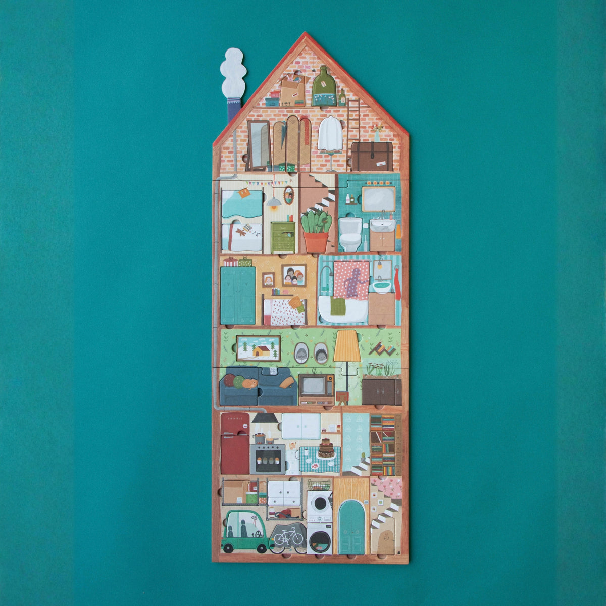 A house-shaped wooden game board featuring a colorful, detailed illustration of different rooms and household items, displayed against a solid teal background.