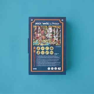 A boxed jigsaw puzzle package labeled 'Magic World Look & Find Puzzle' lays face down on a solid teal background. The box is dark blue with an orange border and a colorful illustrated puzzle scene on the front, plus small circular icons and text near the bottom.