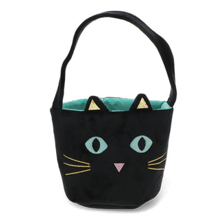 A black cat-shaped bucket bag with embroidered eyes, whiskers, a pink nose, and gold ear accents, featuring a teal interior and a black shoulder strap, shown on a plain white background.
